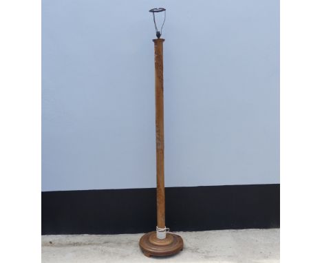 An Early 20th century carved oak standard Lamp, with oriental carvings, W 38 cm x H 182 cm x D 38 cm. 