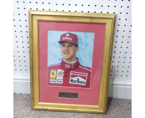 A signed print of Michael Schumacher, together with a signed, limited edition (082 of 250) print 'Winner of Oz' Jenson Button