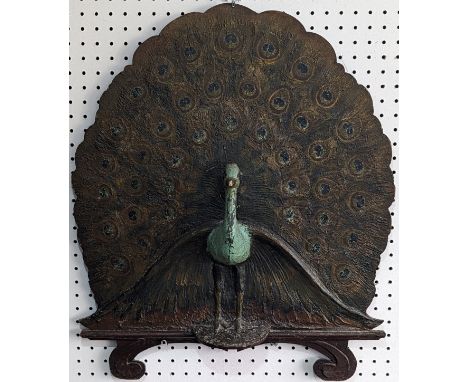 An Arts and Crafts papier mache former peacock Firescreen, W 57 cm x H 69 cm. 