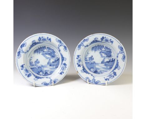 A pair of 19thC European Delftware Bowls, decorated in underglaze blue depictions in the willow style D 17.5cm (2) 