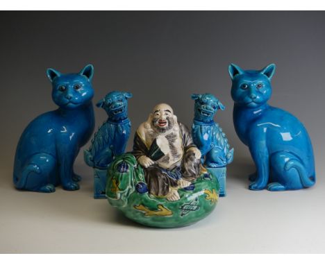 A pair of 20thC Chinese azure blue Dogs of Foo, modelled in upright pose on plinths, H 16cm, together with a pair of Chinese 
