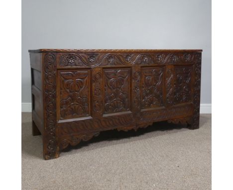 A large 17thC and later oak Coffer with alterations,&nbsp;the moulded hinged top above carved four panel front, on stile supp