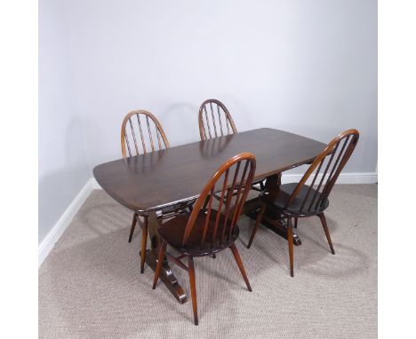 An Ercol dark wood rectangular dining Table and set of four Ercol quaker hoop back Chairs, (Table) W 156 cm x H 72 cm x D 78 