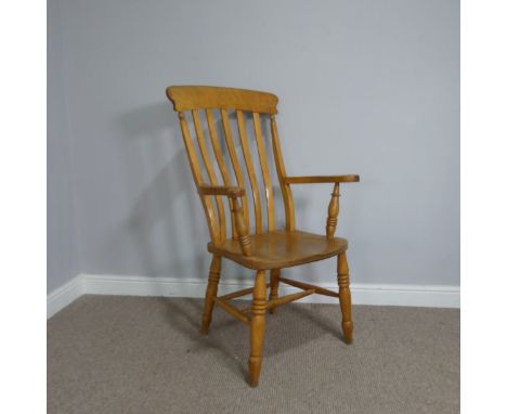 An antique ash and elm windsor high stick back elbow Chair, raised on turned legs and stretchers, W 62.5 cm x H 113.5 cm x D 