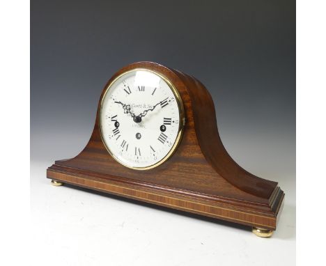 O.Comitti &amp; son of London, a mahogany mantle Clock in 'Napoleon hat' style, raised on brass feet. 