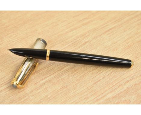 A Parker 51 converter fill fountain pen in black with empire state cap with gold blue diamond clip.