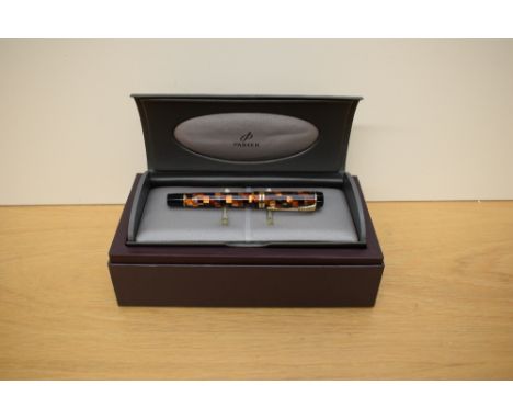 A boxed Parker Duofold Centennial converter fill fountain pen in check amber with gold trim having Parker 18k 750 nib marked 