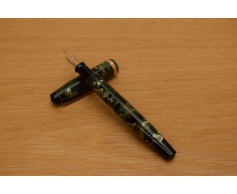 A Parker Challenger button fill fountain pen in green and black marble with broad gold cap band having Parker Fountain Pen 14