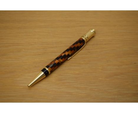 A Parker Duofold ballpoint pen in amber check