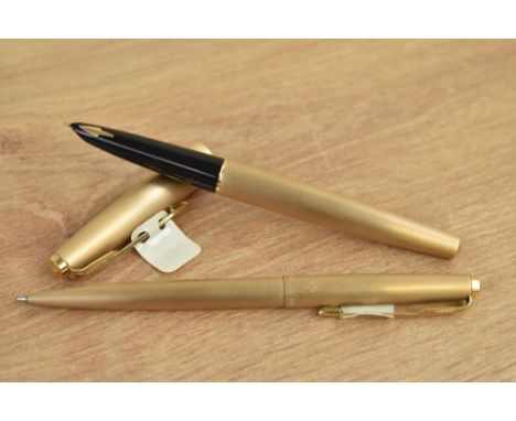 A Parker 61 Cirrus converter fill fountain pen and ballpoint pen in rolled gold. Come with original tags