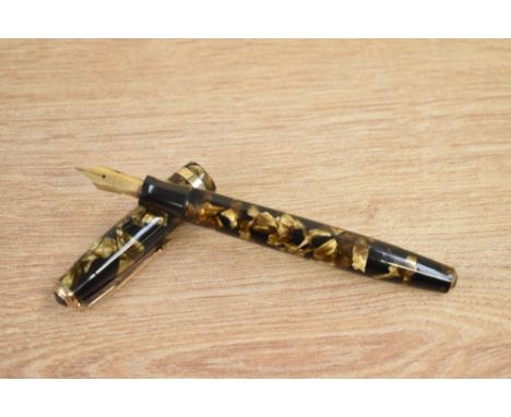 A Parker Duofold  button fill fountain pen in light and dark brown pearl with single gold band to the cap having Parker Duofo