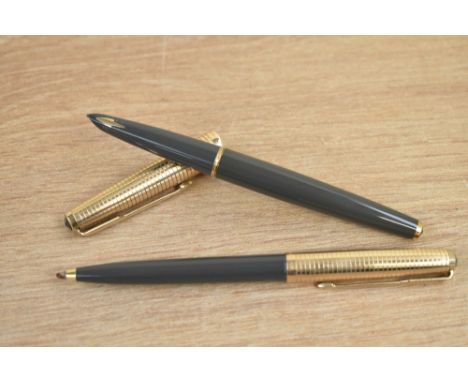 A boxed Parker 61 Consort capillary fill fountain pen and ballpoint pen in  grey with rolled gold cap