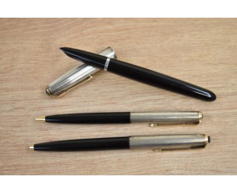 A  boxed Parker 51 aerometric fill fountain pen, propelling pencil and ballpoint pen in black with rolled silver cap