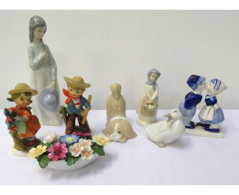 SELECTION OF FIGURINESincluding a Nao girl holding a posy of flowers to her chest, 23cm high; Nao goose, 8cm high; two Miquel