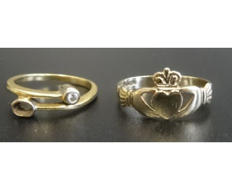 DIAMOND SET CROSSOVER RING in unmarked gold (one stone lacking), ring size N; together with a nine carat gold Claddagh ring, 