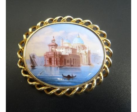 HAND PAINTED ENAMEL BROOCHthe oval panel depicting Santa Maria della Salute in Venice, in unmarked gold twist design mount, 4