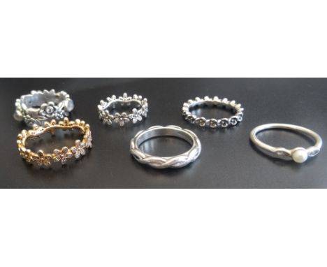 SIX PANDORA SILVER RINGSincluding 'flower'; two 'Dazzling Daisy Band' rings, one in Pandora rose; 'Luminous Leaves'; and an e