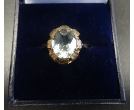 AQUAMARINE SINGLE STONE RINGthe oval cut aquamarine in petal effect surround, on nine carat gold shank, ring size P
