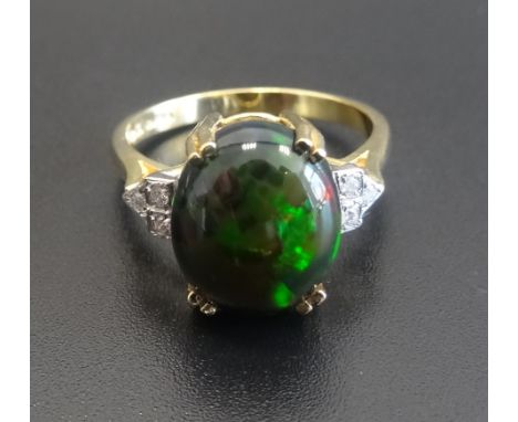 BLACK OPAL AND DIAMOND DRESS RINGthe central oval cabochon opal flanked by three diamonds to each side, on eighteen carat gol