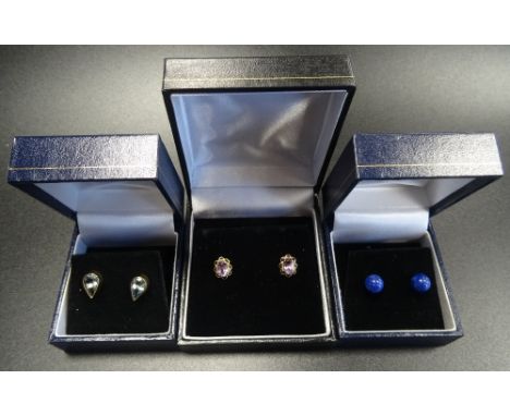 THREE PAIRS OF GEM SET GOLD STUD EARRINGScomprising a pear cut aquamarine pair in nine carat gold; an amethyst pair in unmark