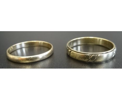 TWO GOLD WEDDING BANDSone in nine carat gold, ring size T-U and approximately 1.6 grams; the other in eight carat gold marked