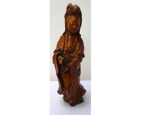 19th CENTURY CHINESE BOXWOOD FIGURE OF GUAN YINstanding in flowing robes and holding a scroll in her right hand, 33cm high 