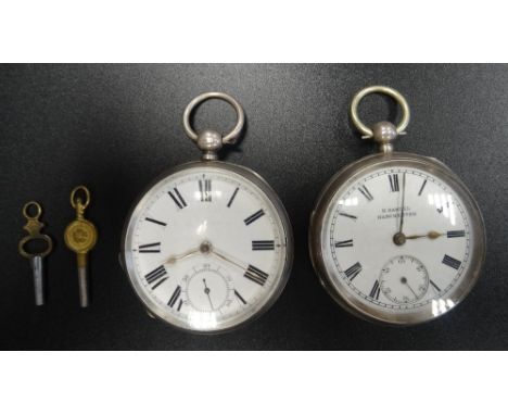 TWO VICTORIAN SILVER CASED POCKET WATCHESboth with black Roman numerals and subsidiary dials on white enamel, one a Waltham a