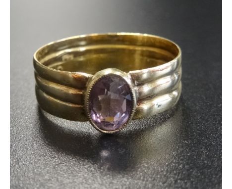 VICTORIAN AMETHYST AND EIGHTEEN CARAT GOLD RINGconstructed from three gold bands, ring size P