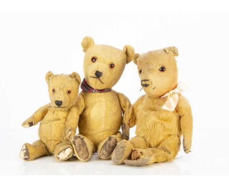 Three post-war Chiltern Hugmee Teddy Bears, with golden mohair, orange and black glass eyes, swivel heads, jointed limbs, two