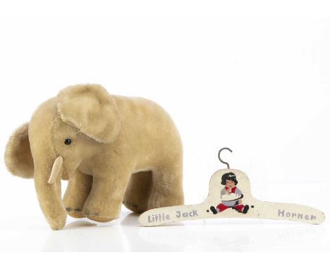 A continental post-war  elephant,  with black glass eyes and felt pads -- 9 1/2in(24cm.) high, and a child's painted Little J