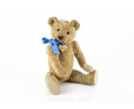 Phillpotts - a British 1920's Teddy Bear,  with blond mohair, black boot button eyes, swivel head joint limbs and inoperative
