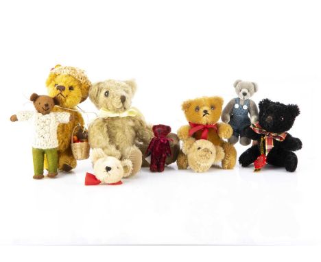 Seven small manufactured Teddy Bears,  including two Hermann bears, and a Steiff teddy bear head brooch and another --9 1/2in