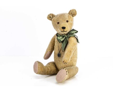 Brampton - a 1920s German Teddy Bear, with blonde mohair, slotted in ears, orange and black glass eyes, swivel head and joint