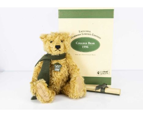 A Steiff limited edition Harrods musical College Teddy Bear, 413 of 2000, plays  "Toy Symphony" by Josef Hayden, wearing gree