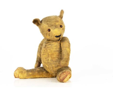 A 1930's Chad Valley Magna type Teddy Bear, with golden mohair, orange and black glass eyes, swivel head, jointed limbs, with