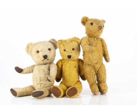 Three post-war Teddy Bears, an Invicta teddy  bear with golden mohair, orange and black glass eyes, brown stitched nose and m