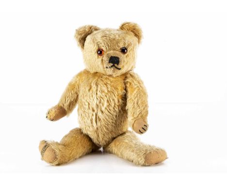 Edward Buchanan - a post -war  Merrythought Teddy Bear, with golden mohair, orange and black glass eyes, black stitched nose 