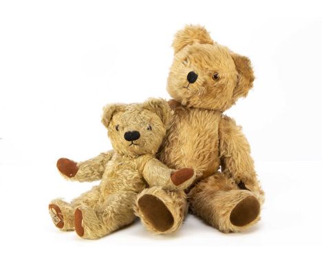 A post-war Chad Valley Teddy Bear, with blonde mohair, orange and black glass eyes, swivel head and jointed limbs with label 