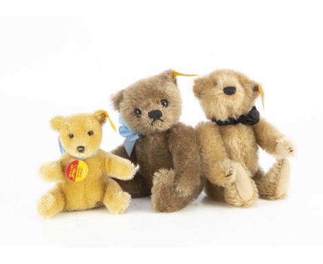 Three small Steiff yellow tag Teddy Bears, including a 1991 Replica Original; a Historic Miniatures with black ribbon and ori