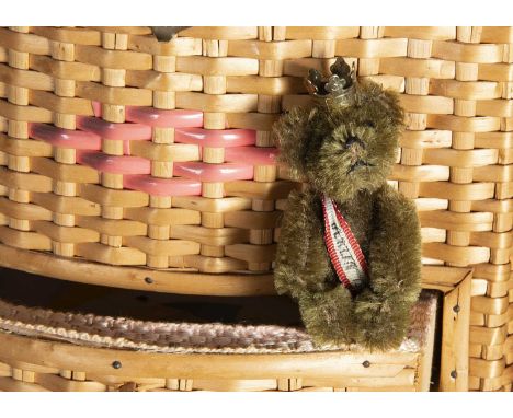 Risworth - a post-war miniature Schuco Berlin Teddy Bear lapel pin, with brown mohair, metal pin eyes, black stitched nose an