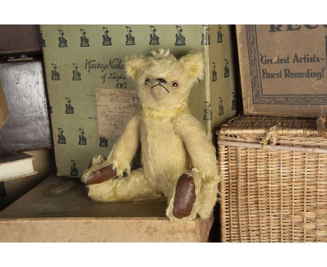 Oldfield - a 1930s British Teddy Bear, with blonde mohair, clear and black glass eyes with brown painted backs, pronounced mu