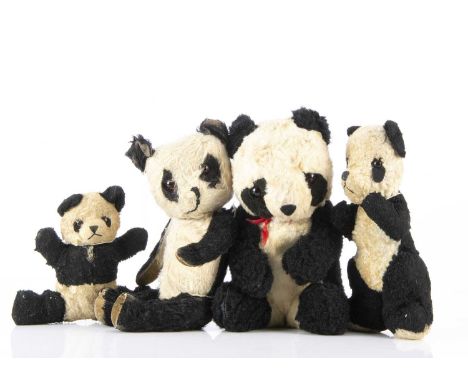 Four post-war British pandas,  comprising of a Chiltern with black and white mohair, swivel head joint limbs and velvet pads 