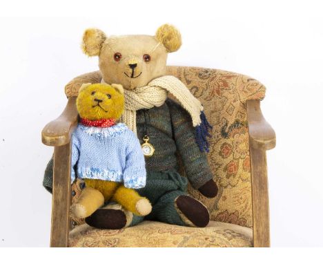 A German 1920's Teddy Bear, with golden mohair, orange and black glass eyes, slotted in ears, replaced nose and pads --20in.(