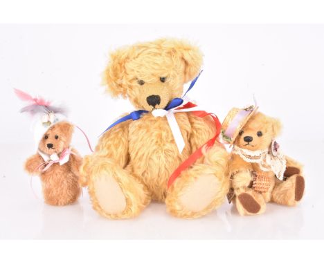 Two Bocs Teganau Welsh artist Teddy Bears, including Taliesin with straw hat, holding a wicker basket, with card tag, a large