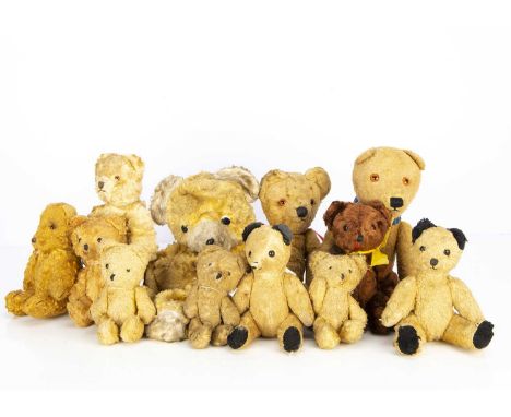 Twelve Eastern European cotton plush Teddy Bears,  including two Sooty-type, Polish bear with clear and black glass eyes with