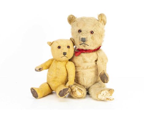 Two post-war Chiltern Teddy Bears, with orange and black glass eyes, black stitched noses and mouths, swivel heads, jointed l