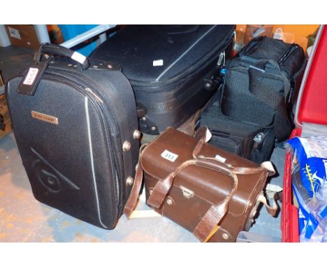 Three luggage cases and two camera bags 