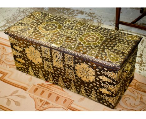 ZANZIBAR TRUNK, antique teak and brass studded with hinged top and side handles, 39cm H x 93cm x 39cm.