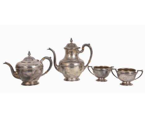 4 Piece Sterling Silver Tea Set.  Marked on bottom.  Weight: 1244 g. Dimensions: (L-R):