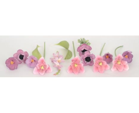 A 20th Century porcelain floral arrangement comprising fourteen purple stem flowers to include tulips and crocus together wit
